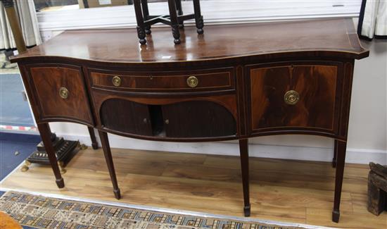 A George III crossbanded mahogany serpentine sideboard, W.6ft 1in. D.2ft 2ihn. H.3ft